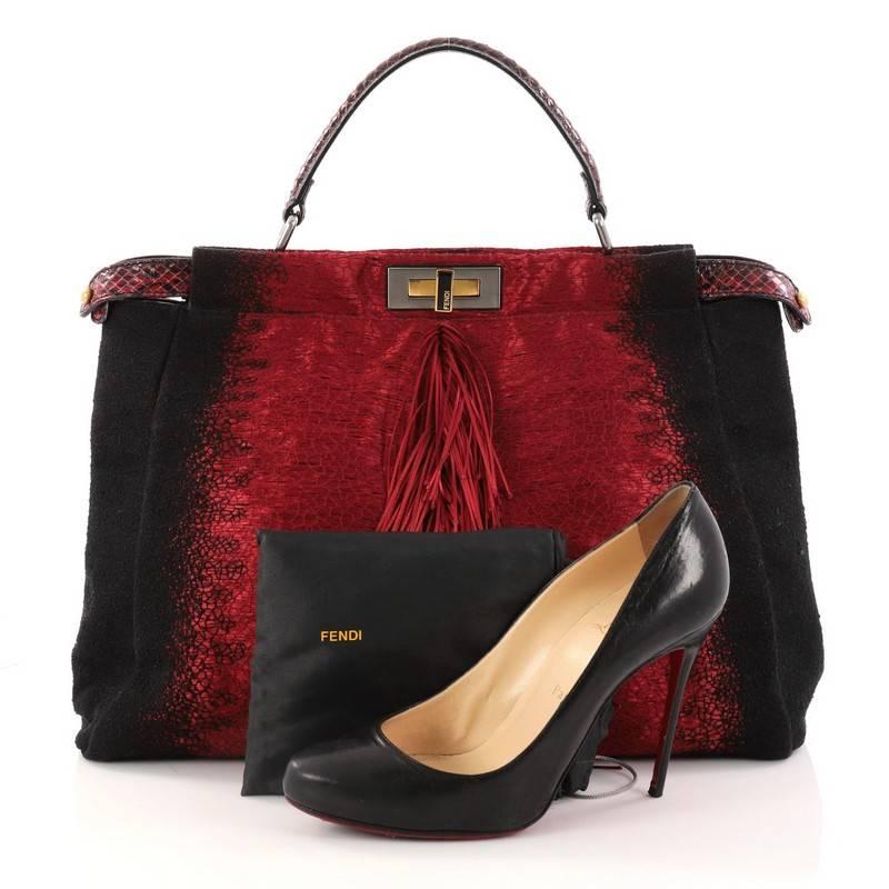 This authentic Fendi Fringe Peekaboo Handbag Textile with Python Large is one of Fendi's best-known designs, exuding a luxurious yet minimalist appearance. Crafted in red and black textile with python trims, this stylish satchel features flat python