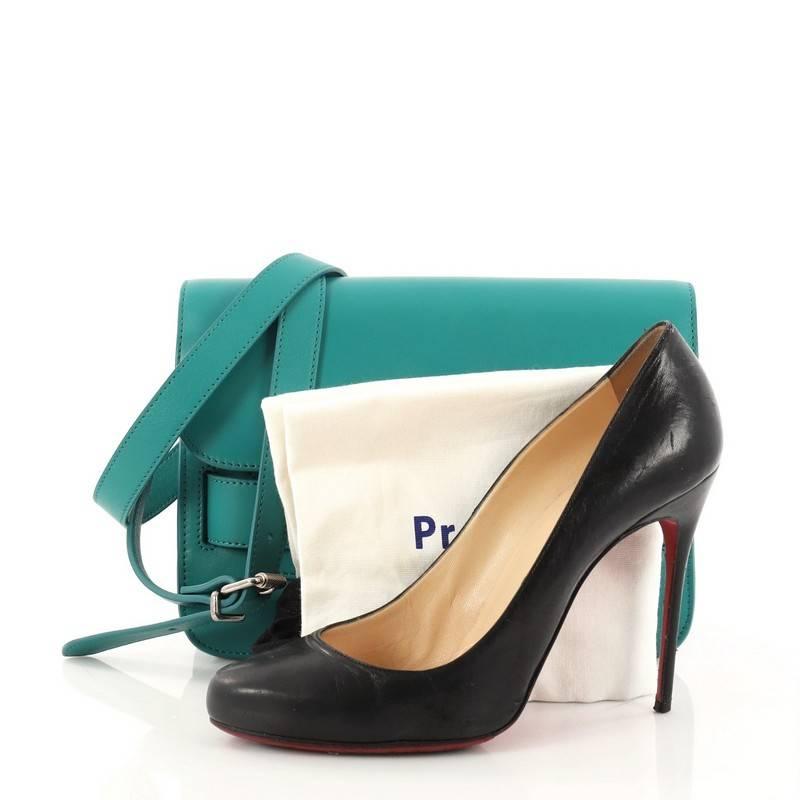 This authentic Proenza Schouler PS11 Crossbody Bag Leather Mini is an urban chic bag loved by fashionistas. Constructed in turquoise leather, this square body bag features detachable and adjustable shoulder strap, faceted cubes, turn lock-fastening