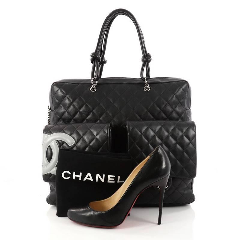 This authentic Chanel Cambon Briefcase Quilted Lambskin Large is a chic and stylish bag from the Cambon collection popular among Chanel lovers everywhere. Crafted from black leather in signature diamond quilted, this bag features a large white