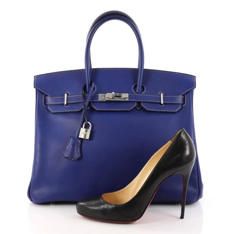 This authentic Hermes Candy Birkin Handbag Epsom 35 stands as one of the most-coveted accessory made for the modern woman. Crafted from Bleu Electrique epsom leather, this stand-out tote features dual-rolled top handles, frontal flap, stand-out