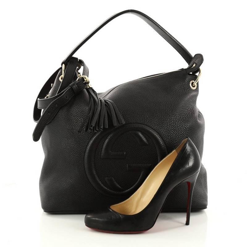 This authentic Gucci Soho Convertible Hobo Leather Large is a fresh casual-chic hobo made for everyday excursions. Crafted from classic black leather, this no-fuss hobo features Gucci's signature interlocking GG logo stitched at the front, single