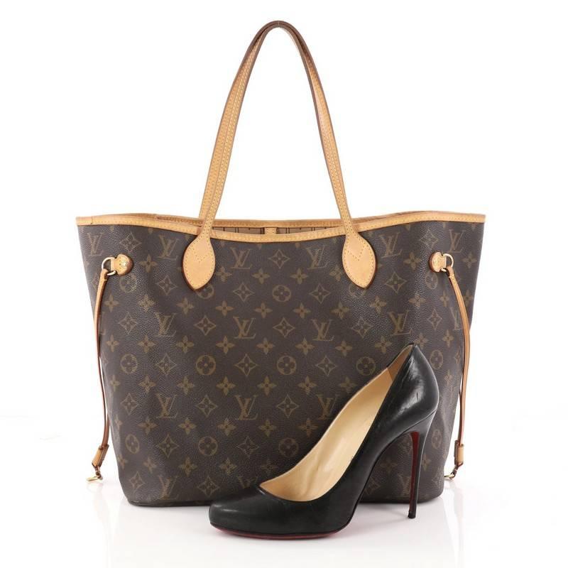 This authentic Louis Vuitton Neverfull Tote Monogram Canvas MM is a perfect companion for daily excursions. Crafted from signature brown monogram coated canvas, this iconic, easy-to-carry tote features natural cowhide leather trim, dual tall