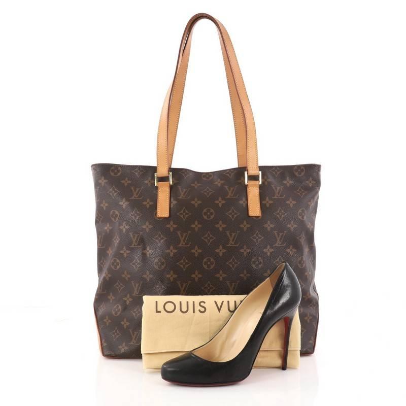 This authentic Louis Vuitton Cabas Mezzo Monogram Canvass is a marvelous tote that is ideal for everyday use. Constructed from Louis Vuitton's brown monogram canvas, this chic city tote features vachetta cowhide leather shoulder straps, leather base