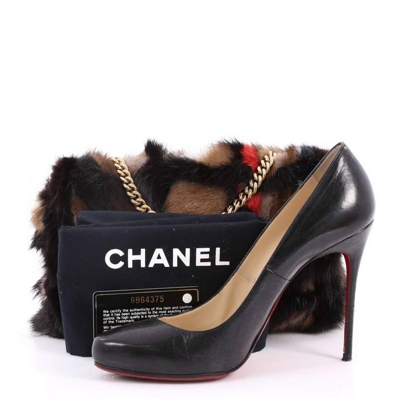 This authentic Chanel Multicolor Arm Candy Flap Bag Mink Medium is a perfect companion with its exquisite style and elegant look for the boldest of fashionistas. Beautifully crafted in genuine tonal multicolor mink fur, this stylish bag features a