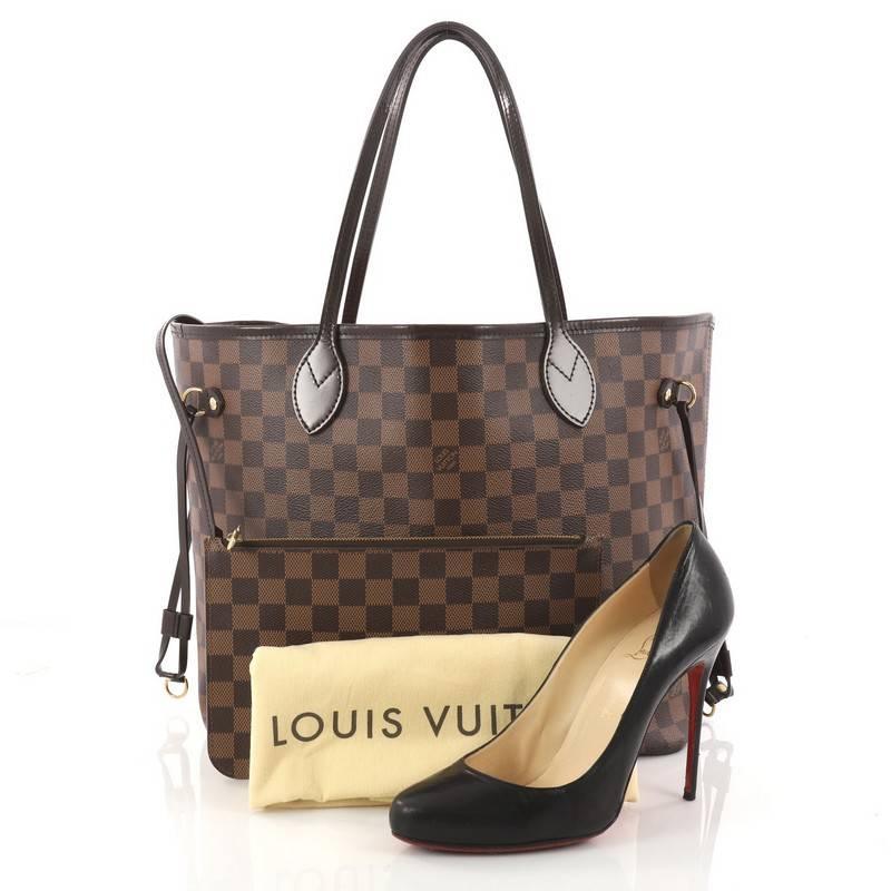 This authentic Louis Vuitton Neverfull NM Tote Damier MM is a popular and practical oversized tote beloved by many. Constructed with Louis Vuitton's signature damier ebene coated canvas, this tote features dual slim dark brown leather handles, side