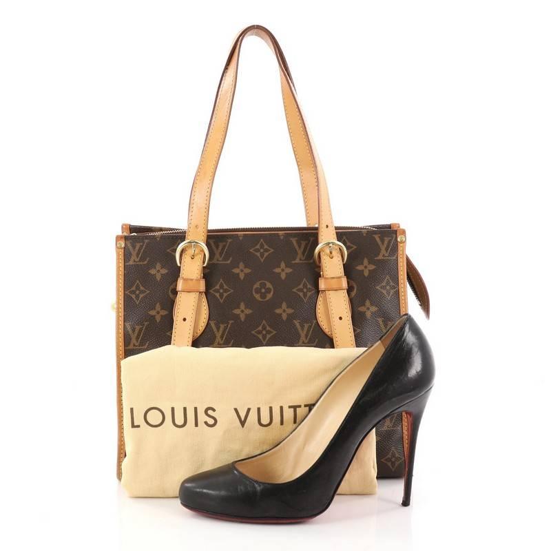 This authentic Louis Vuitton Popincourt Tote Monogram Canvas Haut is a practical yet iconic bag that is sure to be a wardrobe staple. Crafted from Louis Vuitton's iconic brown monogram coated canvas, this bag features cowhide vachetta leather