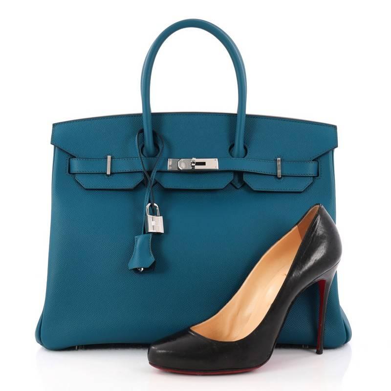 This authentic Hermes Birkin Handbag Mykonos Epsom with Palladium Hardware 35 stands as one of the most-coveted accessory made for the modern woman. Crafted from Mykonos Epsom leather, this stand-out tote features dual-rolled top handles, frontal