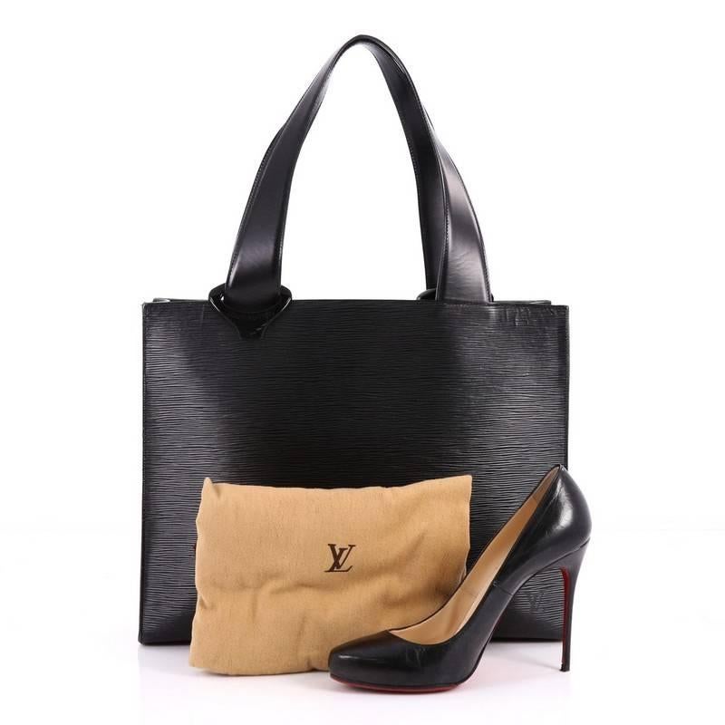 This authentic Louis Vuitton Z Gemeaux Tote Epi Leather is an ideal bag for any occasion. Crafted from black epi leather, this elegant tote features a structured silhouette, dual-flat leather handles with highly stylized resin links on each side,