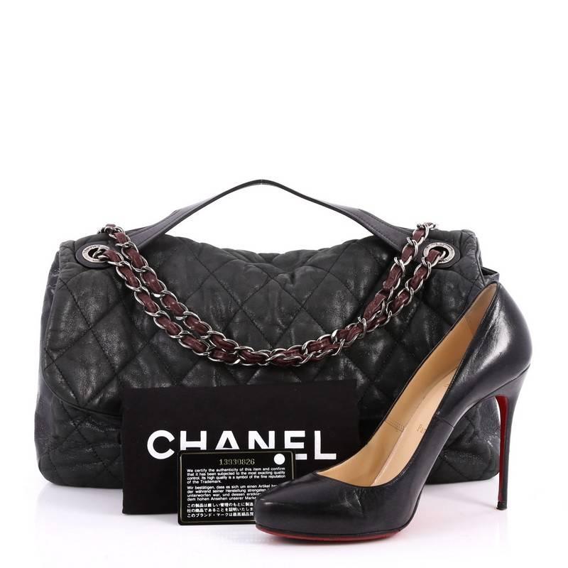 This authentic Chanel In the Mix Flap Bag Quilted Iridescent Calfskin With Glazed Calfskin Jumbo is from the brands' 2011 Cruise Collection. Crafted in iridescent quilted black calfskin with glazed leather, this chic bag features a leather top
