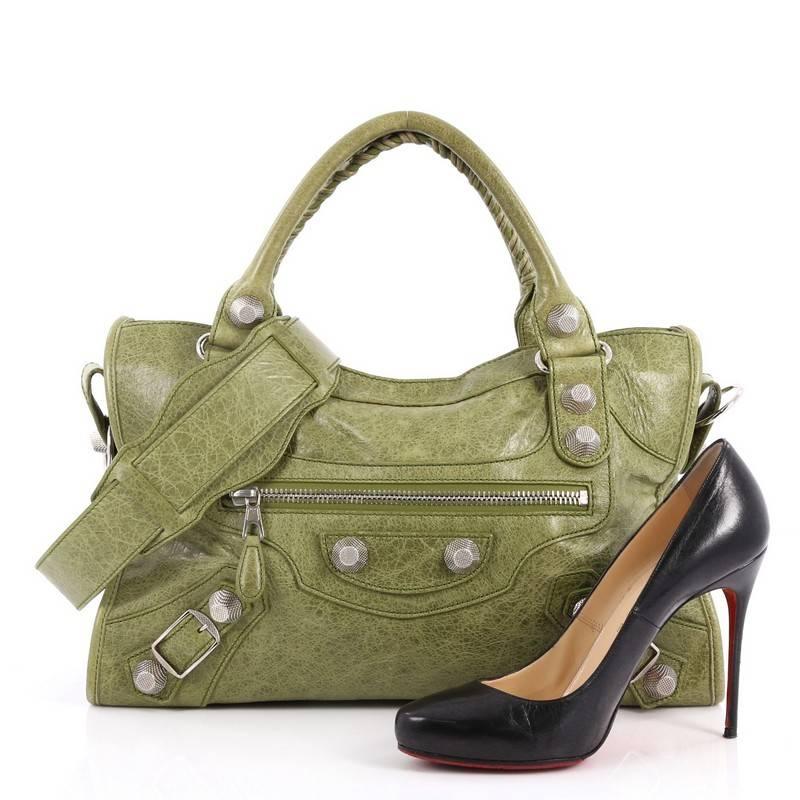 This authentic Balenciaga City Giant Studs Handbag Leather Medium is for the on-the-go fashionista. Constructed from green leather, this popular bag features dual braided woven tall handles, exterior front zip pocket, iconic Balenciaga giant studs