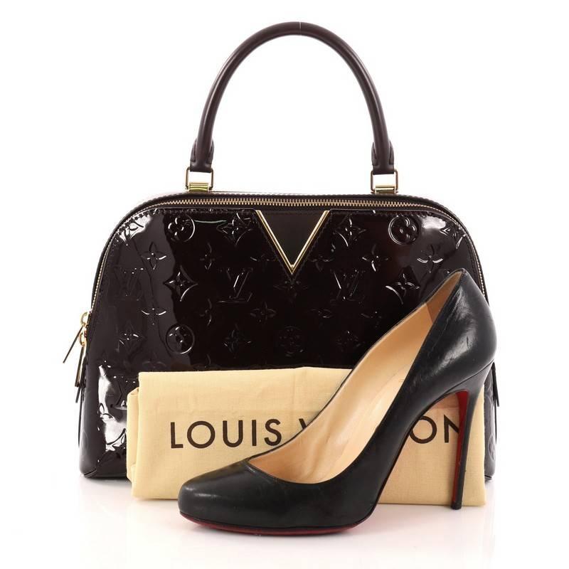 This authentic Louis Vuitton Melrose Handbag Monogram Vernis is an updated version of the classic Melrose Avenue bag. Crafted from Louis Vuitton's amarante monogram vernis leather, this luxurious tote features single top handle, V signature in