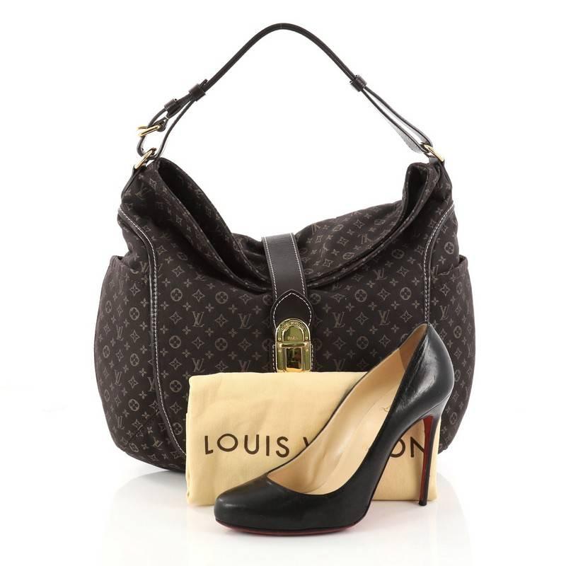 This authentic Louis Vuitton Romance Handbag Monogram Idylle is a statement piece you can surely take from day to night. Crafted with Louis Vuitton's signature brown monogram idylle canvas, this bag features side slip pockets, an adjustable shoulder