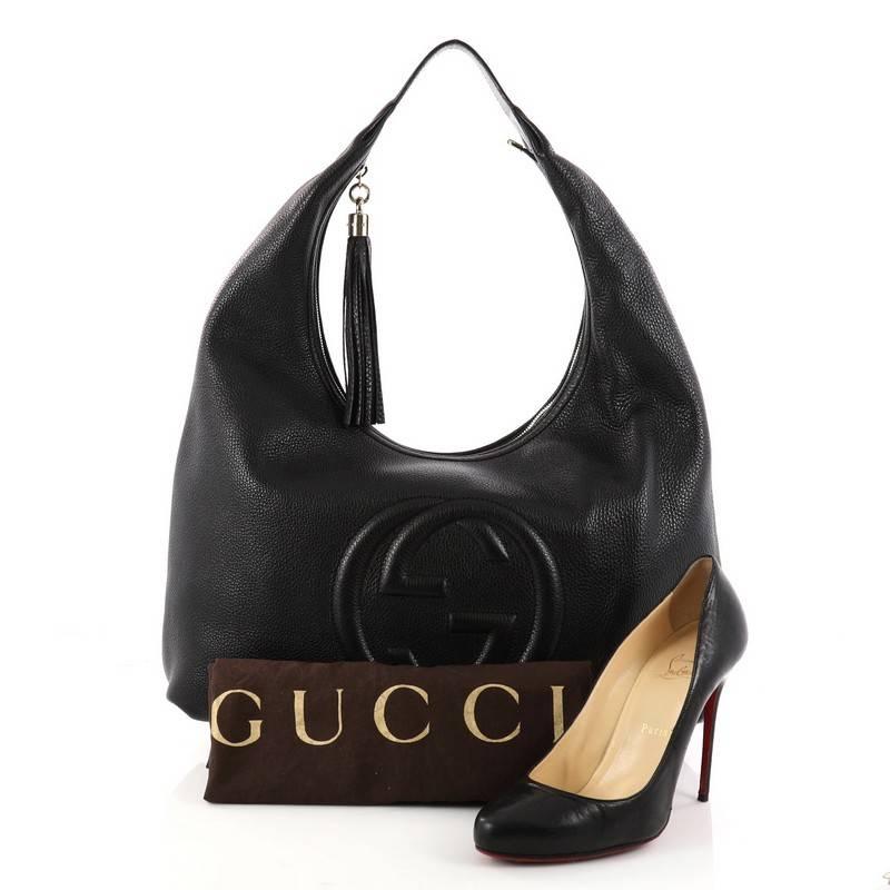 This authentic Gucci Soho Hobo Leather Large is a fresh, casual-chic hobo made for everyday excursions. Crafted from black leather, this no-fuss hobo features Gucci's signature interlocking GG logo stitched at the front, single loop shoulder strap,