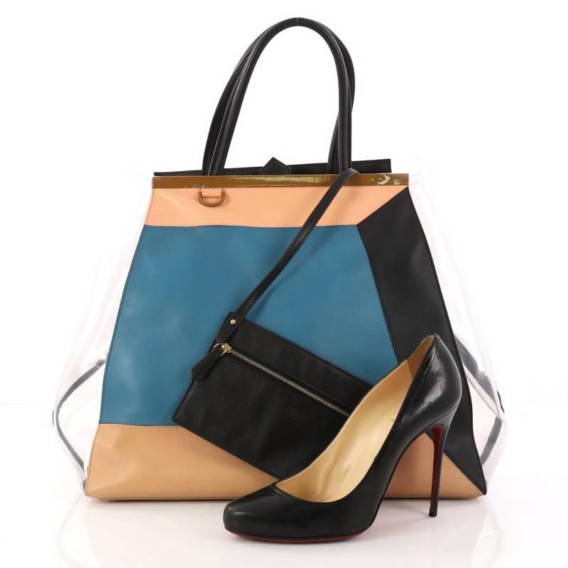 This authentic Fendi Color Block 2Jours Handbag Leather and PVC Large updates its popular design with an iconic, kitschy abstract motif. Crafted from multicolor leather and PVC, this structured tote features dual-rolled leather handles, a top bar