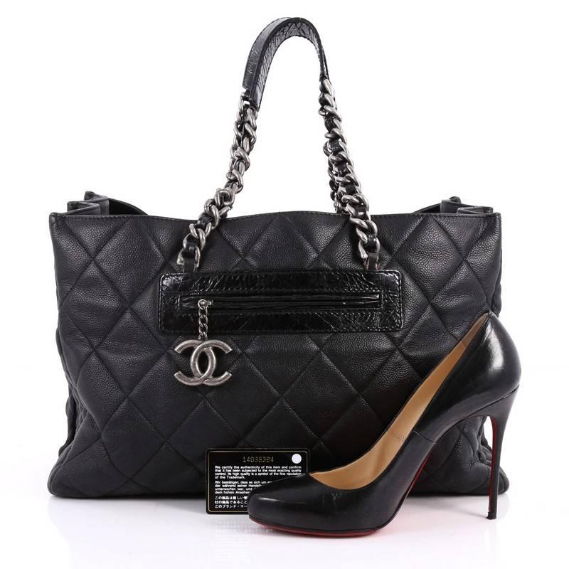 This authentic Chanel Coco Casual Tote Quilted Caviar Large is a gorgeous and slouchy tote perfect for your everyday needs. Crafted in black quilted caviar leather, this chic bag features dual woven-in leather chain strap with shoulder pads,