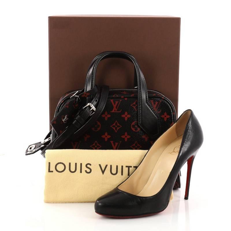 This authentic Louis Vuitton Dora Soft Handbag Limited Edition Monogram Infrarouge BB is an edgy design from Louis Vuitton's Creative Director, Nicolas Ghesquiere. Crafted from glossy red and black monogram infrarouge coated canvas with black calf