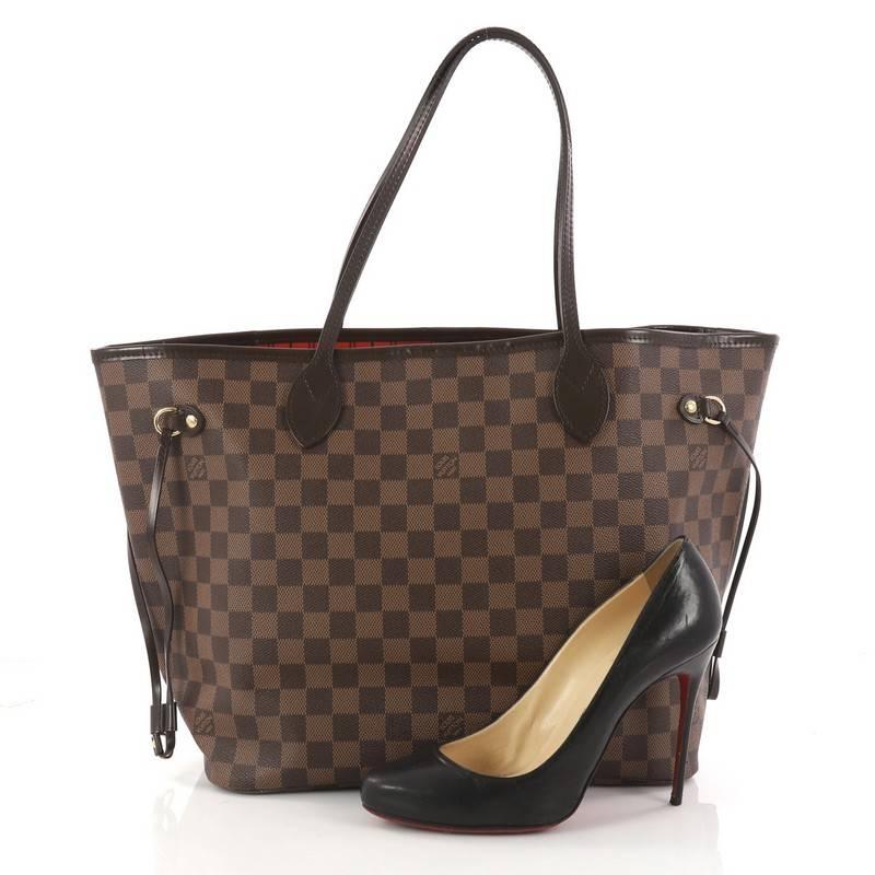 This authentic Louis Vuitton Neverfull Tote Damier MM is a popular and practical tote beloved by many. Constructed with Louis Vuitton's signature damier ebene coated canvas, this tote is spacious and structured without being bulky. The side laces