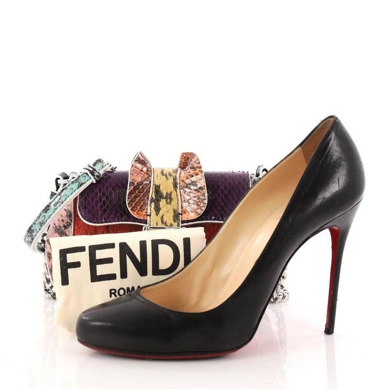 This authentic Fendi Wave Baguette Python Micro channels a playfully designed bag that's sure to be an eye-catching statement. Crafted from genuine multi colored python skin, this stylish bag features a chain and leather strap, color blocked design,