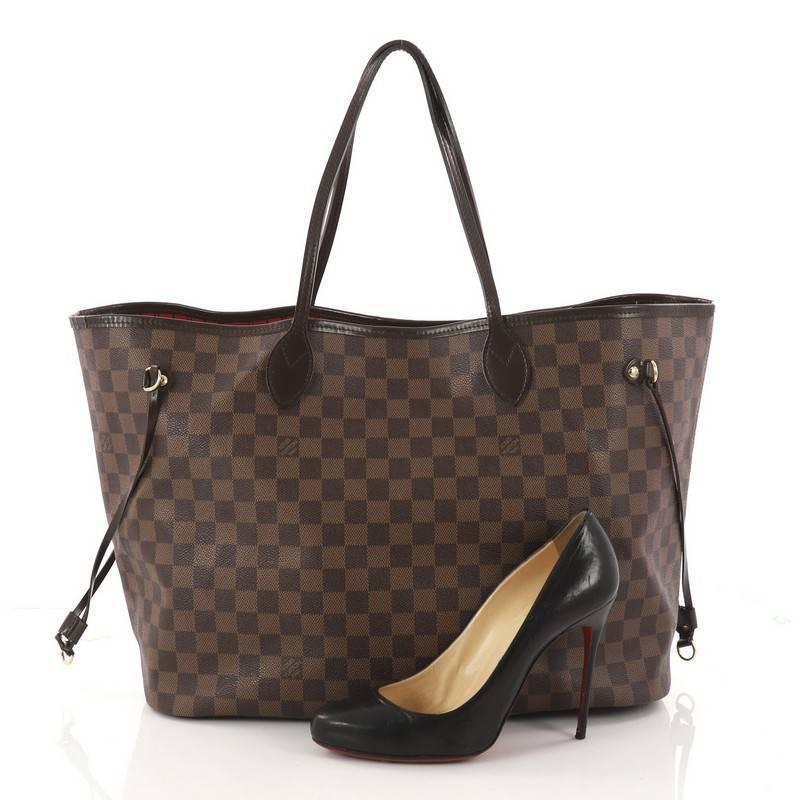 This authentic Louis Vuitton Neverfull Tote Damier GM is a popular and practical tote beloved by many. Constructed with Louis Vuitton's signature damier ebene coated canvas, this tote is spacious and structured without being bulky. The side laces