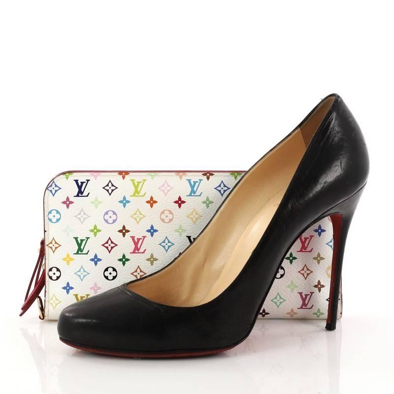 This authentic Louis Vuitton Insolite Wallet Monogram Multicolor is a great functional wallet. Crafted from white monogram multicolor coated canvas, this eye-catching compact accessory features gold-tone hardware accents. The double snap closure