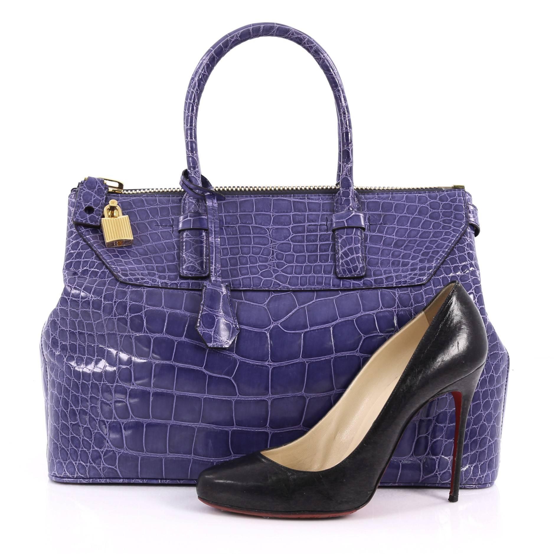 This authentic Tom Ford Petra Tote Crocodile Medium is ideal for everyday casual looks or business excursions. Crafted in genuine purple crocodile, this minimalist yet stylish tote features tall dual-rolled handles, protective base studs, lock