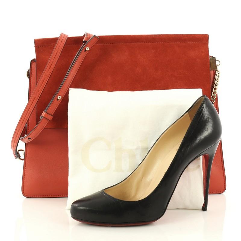 This authentic Chloe Faye Shoulder Bag Leather and Suede Medium personifies Chloe's unique luxe bohemian aesthetic with an ode to the 70's. Crafted in red orange leather and suede, this sleek bag features a ring with chain, gusseted sides, stamped
