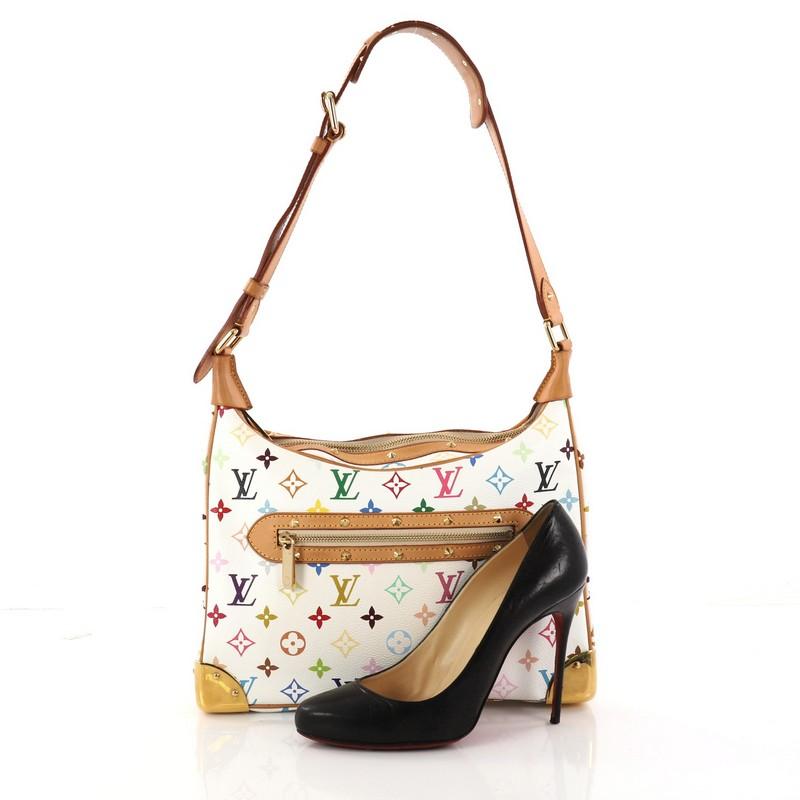This authentic Louis Vuitton Boulogne Handbag Monogram Multicolor showcases a stylish and stunning design perfect for everyday use. Crafted from white monogram multicolor coated canvas, this satchel features an adjustable shoulder strap, vachetta