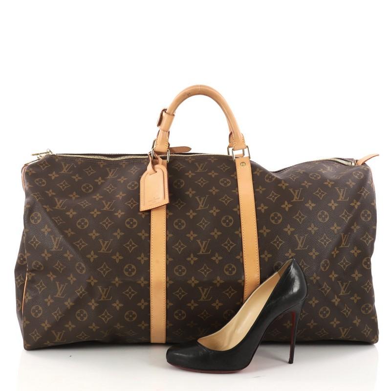 This authentic Louis Vuitton Keepall Bag Monogram Canvas 60 is a classic, sophisticated duffle, perfect for traveling in style. Crafted in iconic brown monogram coated canvas, this oversized duffle features dual-rolled leather handles, vachetta