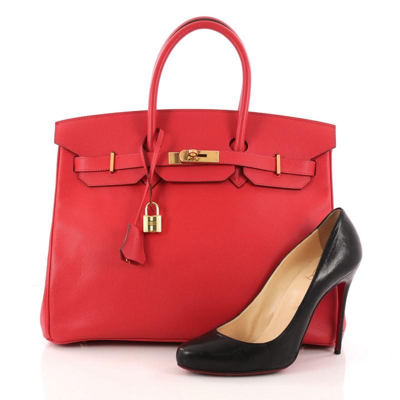 This authentic Hermes Birkin Handbag Rouge Vif Epsom with Gold Hardware 35 stands as one of the most-coveted accessory made for the modern woman. Crafted from Rouge Vif epsom leather, this stand-out tote features dual-rolled top handles, frontal