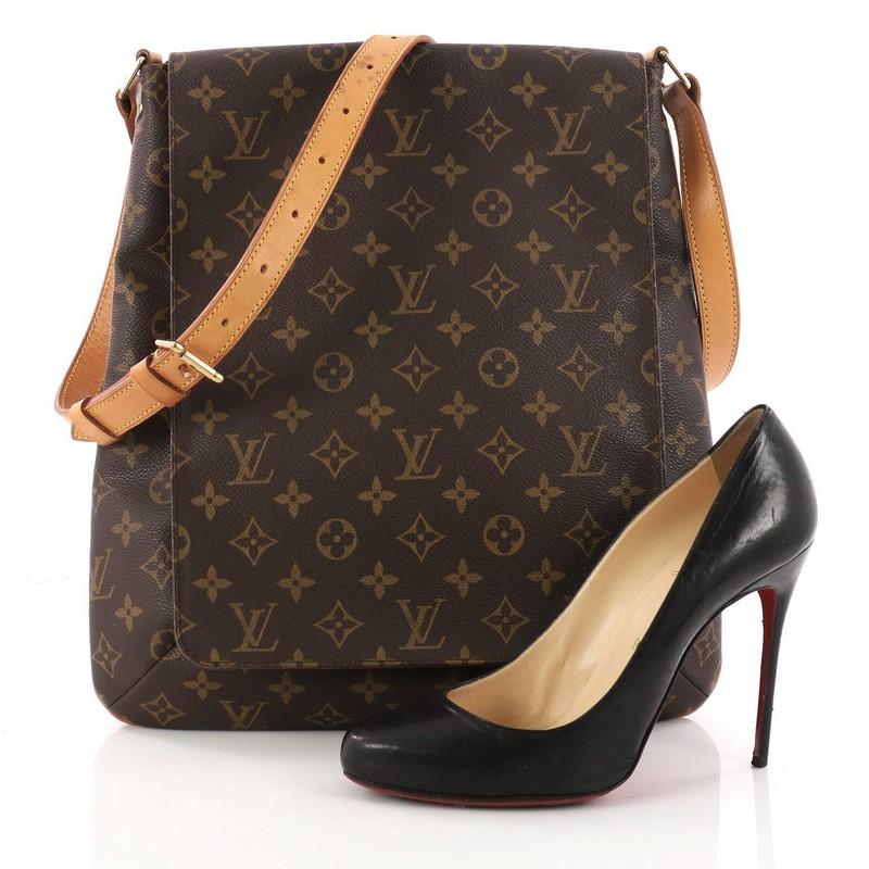 This authentic Louis Vuitton Musette Salsa Handbag Monogram Canvas GM is a minimalist and functional shoulder bag. Crafted from brown monogram coated canvas, this oversized bag features an adjustable shoulder strap and gold-tone hardware accents.