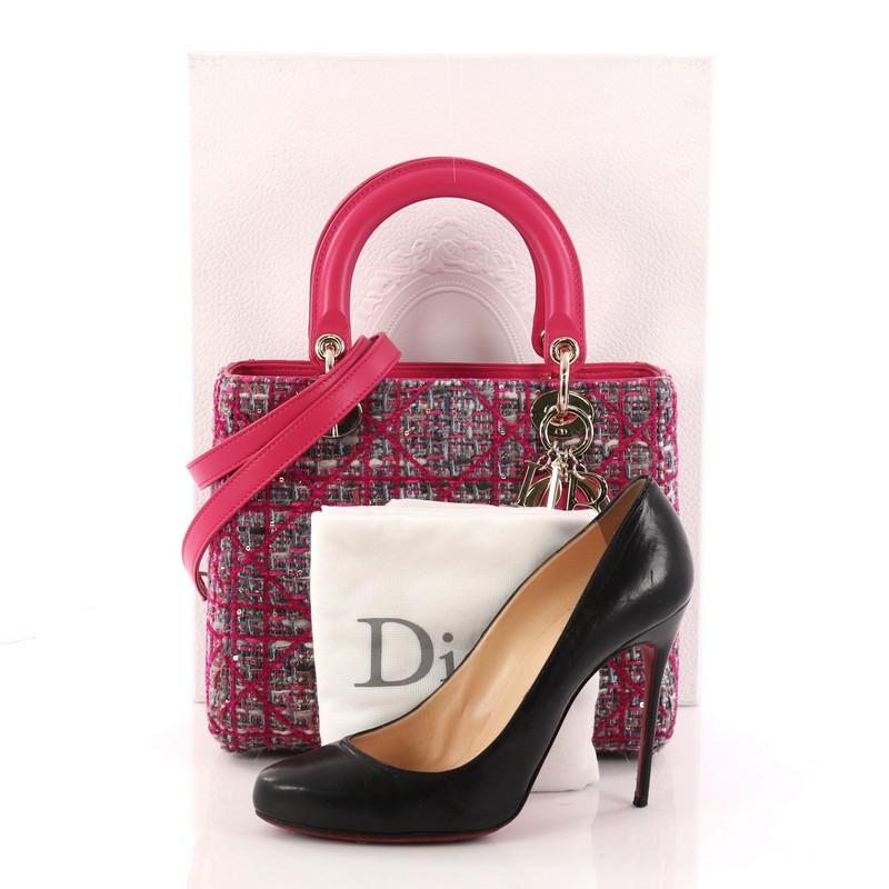 This authentic Christian Dior Lady Dior Handbag Cannage Quilt Tweed with Leather Medium is a gorgeous bag that every fashionista needs in her wardrobe. Crafted from pink with multicolored cannage quilted tweed with pink leather trims, this boxy tote