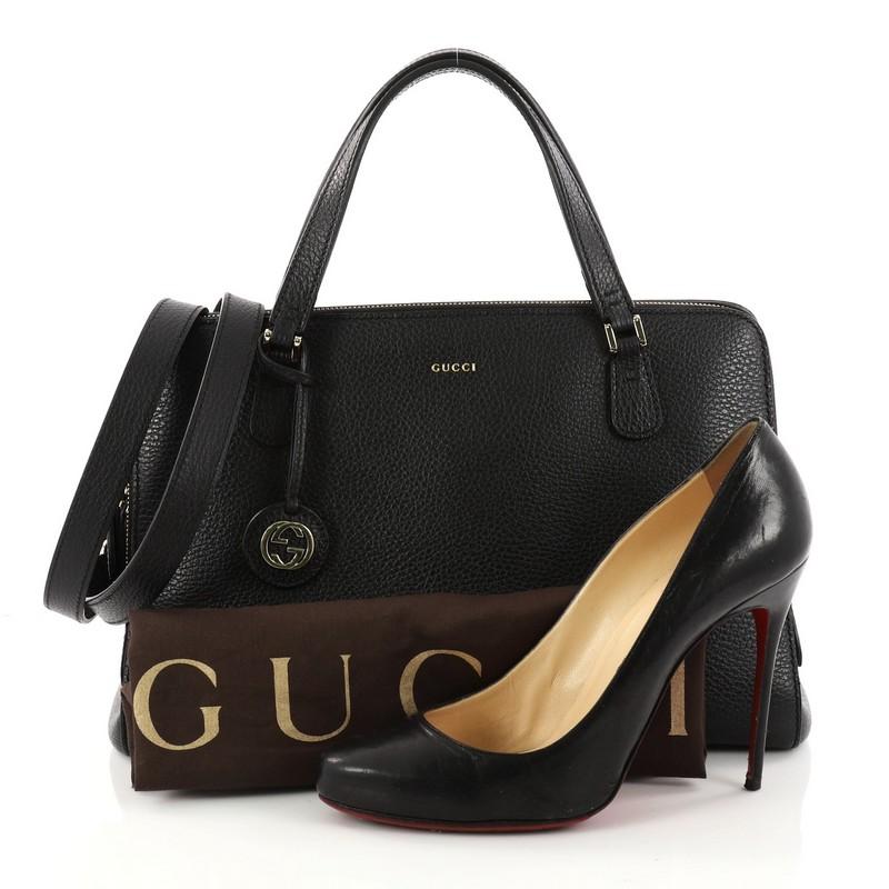 This authentic Gucci Lady Dollar Handle Bag Leather Medium is sophisticated and minimalist in design ideal for everyday use. Crafted from black leather, this bag features dual-flat leather handles, Gucci stamp logo, zip compartment and gold-tone