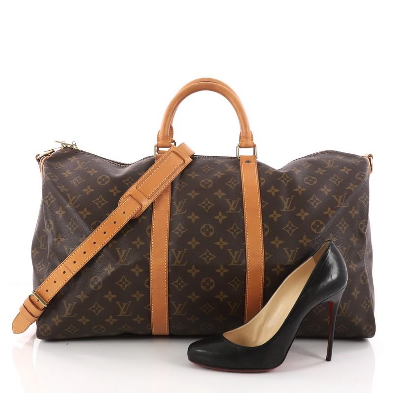 This authentic Louis Vuitton Keepall Bandouliere Bag Monogram Canvas 50 is the perfect purchase for a weekend trip, and can be effortlessly paired with any outfit from casual to formal. Crafted with traditional Louis Vuitton brown monogram coated