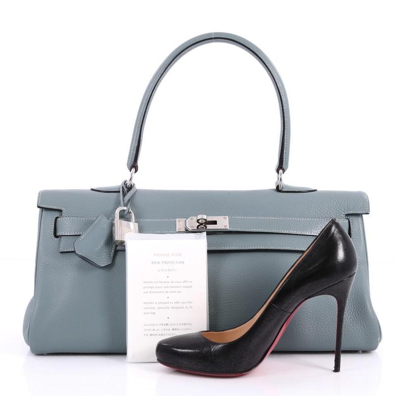 This authentic Hermes Shoulder Kelly Handbag Clemence 42 is a rare collector's item made for any Hermes lover. Exquisitely created by designer Jean Paul Gaultier in iconic ciel clemence leather, this classic Kelly style showcases Hermes' beautiful
