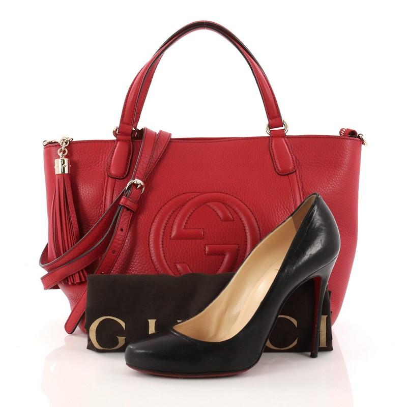 This authentic Gucci Soho Convertible Top Handle Bag Leather Small is a fresh, chic tote made for everyday excursions. Crafted from red leather, this no-fuss tote features Gucci's signature interlocking GG logo stitched at the front, dual looped top