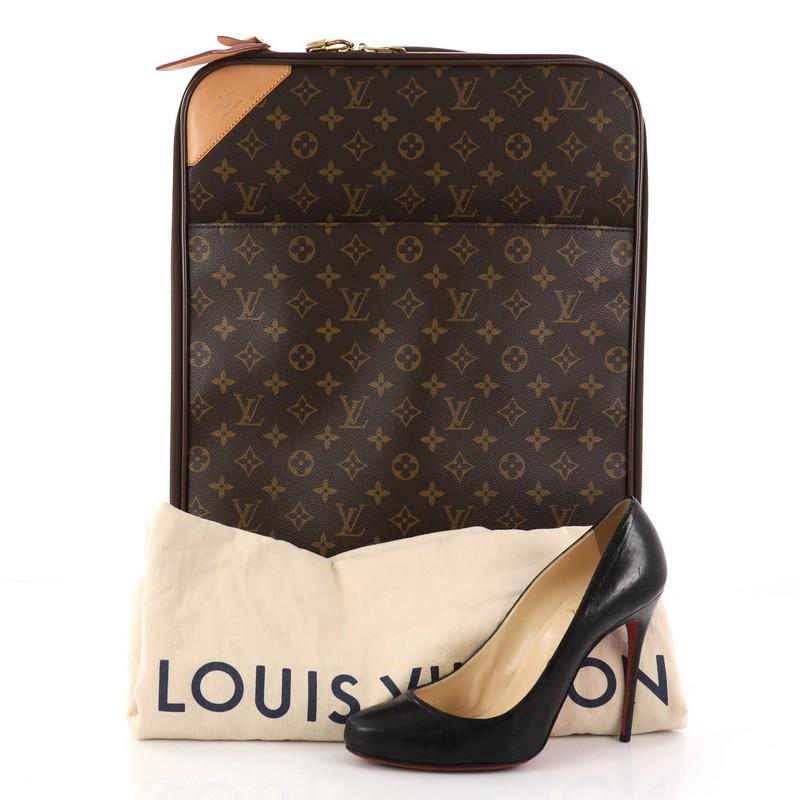 This authentic Louis Vuitton Pegase Luggage Monogram Canvas 45 is a sleek and sturdy suitcase for all your travels. Crafted from Louis Vuitton's iconic brown monogram coated canvas, this functional luggage features cowhide leather trimmings,