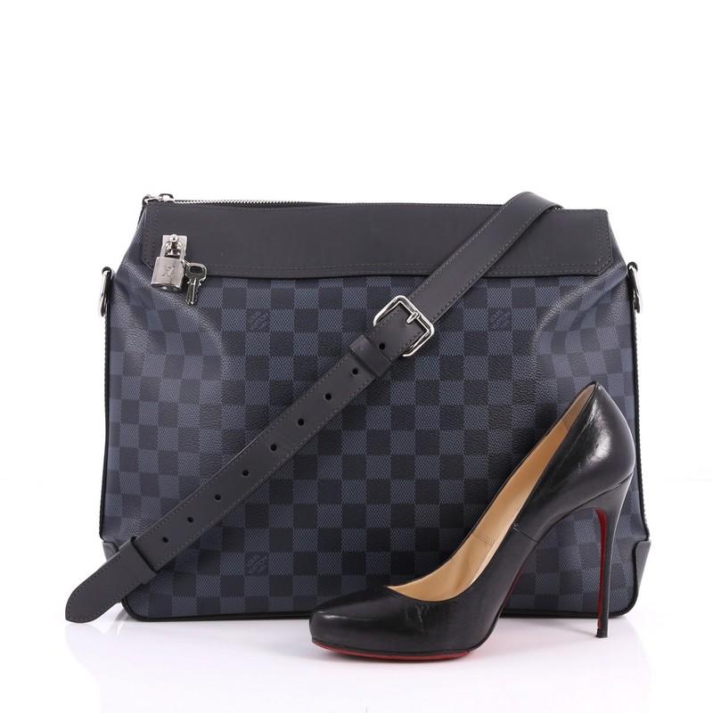 This authentic Louis Vuitton Greenwich Messenger Bag Damier Cobalt is the perfect travel companion that combines style and functionality. Constructed in damier cobalt coated canvas, this bag features adjustable leather strap, black leather trims,