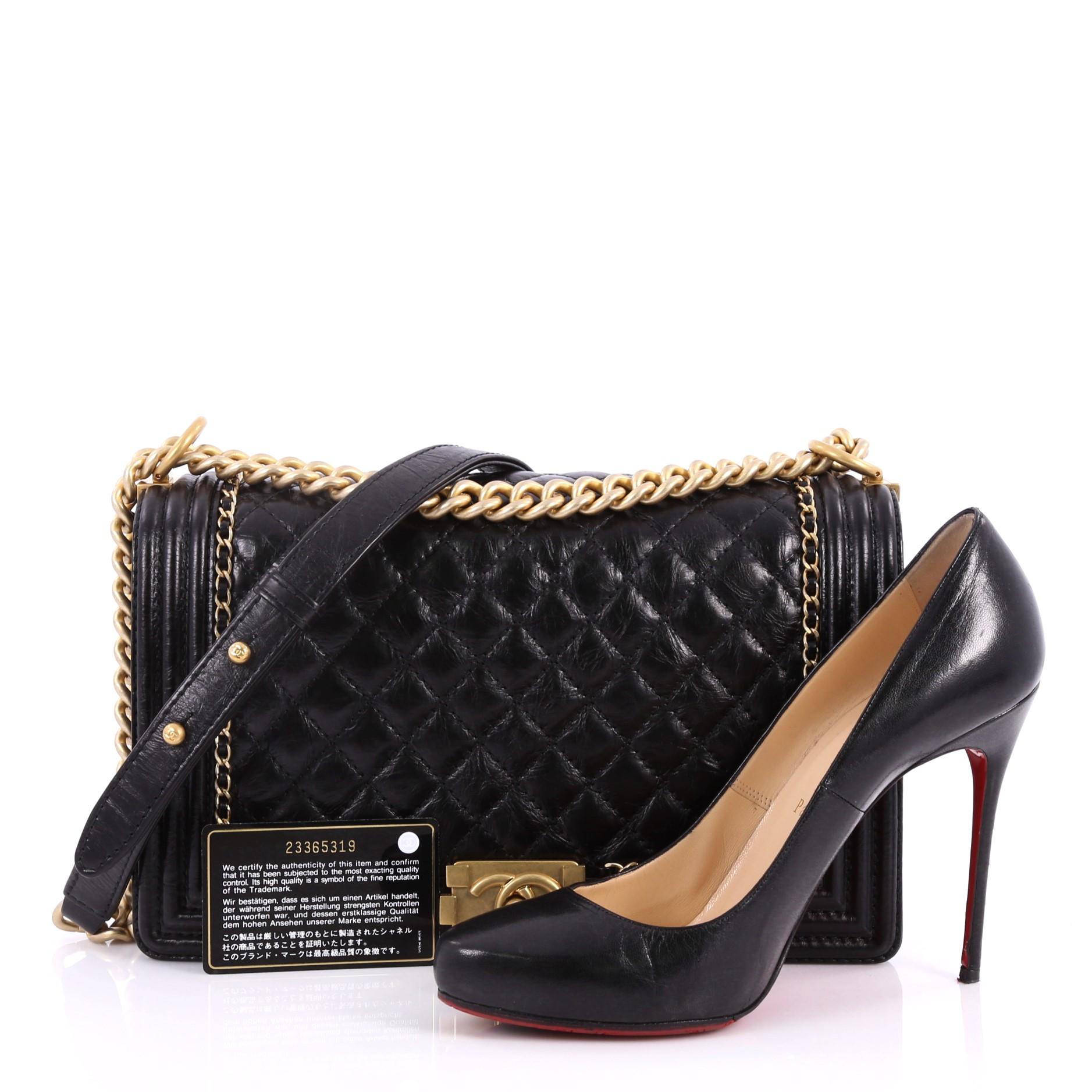 This authentic Chanel Jacket Boy Flap Bag Quilted Aged Calfskin New Medium is a chic and stylish bag inspired by iconic Chanel jackets. Crafted in black quilted aged calfskin leather, this Boy flap bag features a chunky chain-link strap with leather