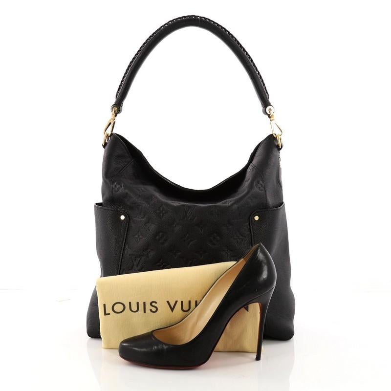 This authentic Louis Vuitton Bagatelle Hobo Monogram Empreinte Leather is a versatile and chic bag perfect for your everyday looks. Crafted from black monogram empreinte leather, this luxurious hobo features a braided handle, exterior flat pockets