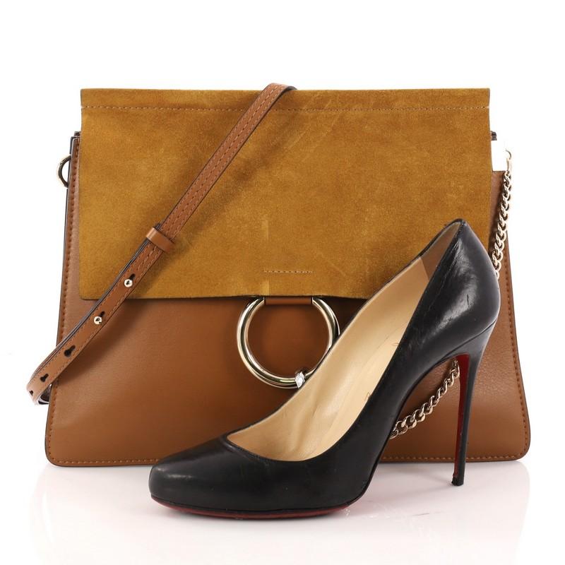 This authentic Chloe Faye Shoulder Bag Leather and Suede Medium personifies Chloe's unique luxe bohemian aesthetic with an ode to the 70's. Crafted in brown leather and suede, this sleek bag features a ring with chain, gusseted sides, stamped logo