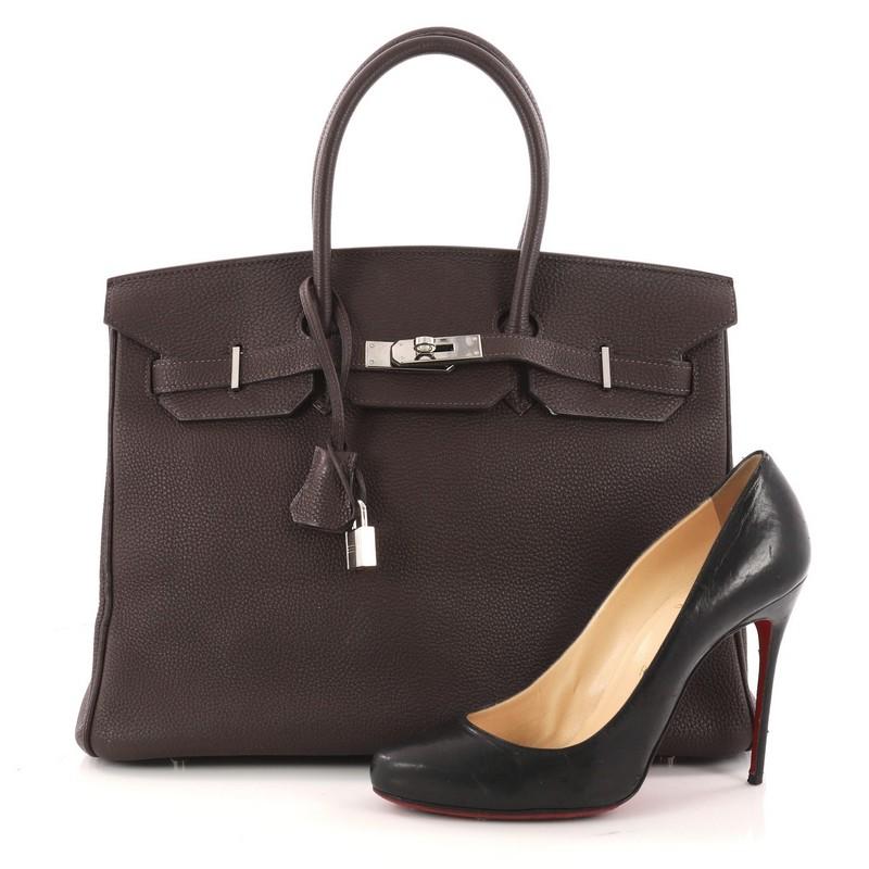 This authentic Hermes Birkin Handbag Café Togo with Palladium Hardware 35 stands as one of the most-coveted bags. Constructed from scratch-resistant, iconic Café Togo leather, this stand-out tote features dual-rolled top handles, frontal flap,