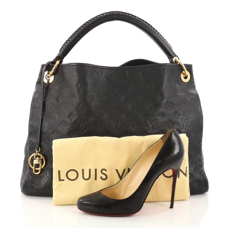 This authentic Louis Vuitton Artsy Handbag Monogram Empreinte Leather MM is an iconic hobo. Crafted from navy blue monogram embossed empreinte leather, this luxurious and refined hobo features a single looped braided top handle with polished gold