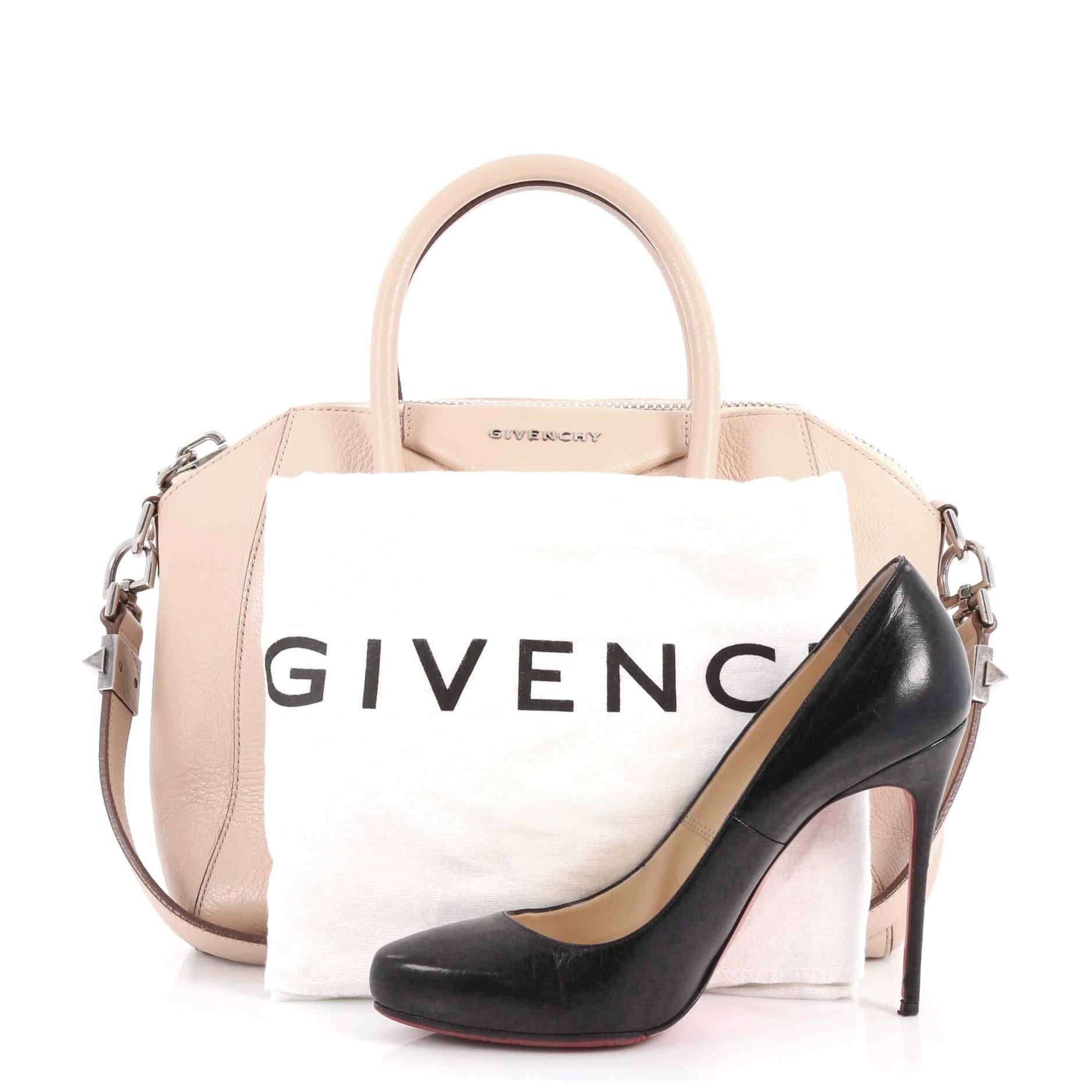 This authentic Givenchy Antigona Bag Leather Small combines style and functionality all-in-one. Crafted from blush pink leather, this structured handle bag is designed with dual-rolled leather handles and silver-tone hardware accents. The bag's zip
