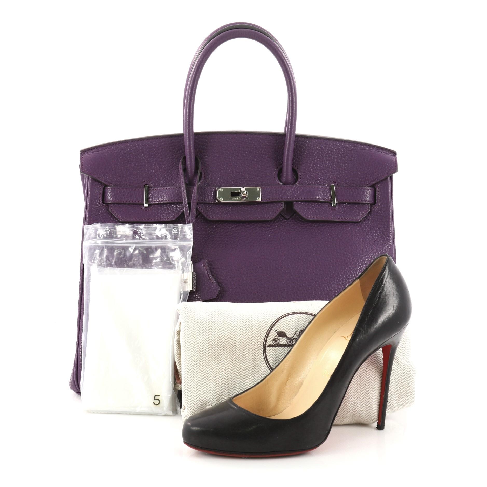 This authentic Hermes Birkin Handbag Ultraviolet Purple Clemence with Palladium Hardware 35 stands as one of the most-coveted and timeless bags fit for any fashionista. Constructed from scratch-resistant ultraviolet purple clemence leather, this bag