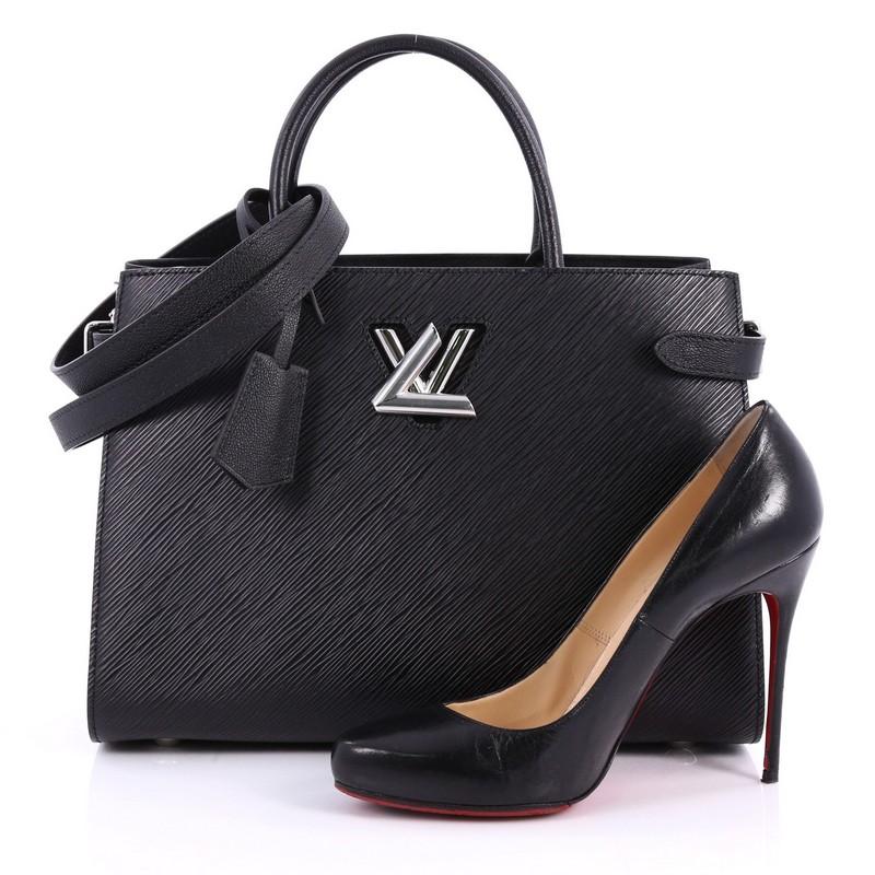 This authentic Louis Vuitton Twist Tote Epi Leather is a combination of modern lines and luxurious details. Crafted in black epi leather, this tote features two toron handles, side body straps, and silver-tone hardware accents. Its iconic twist lock