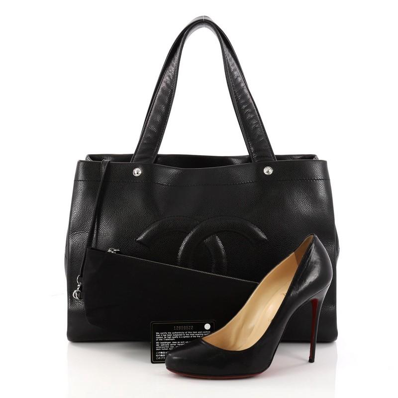This authentic Chanel Ultimate Executive Tote Caviar Large is an everyday tote made for the modern woman. Crafted in black caviar leather, this tote features dual-flat handles, four exterior pocket compartments, diamond quilted leather details,