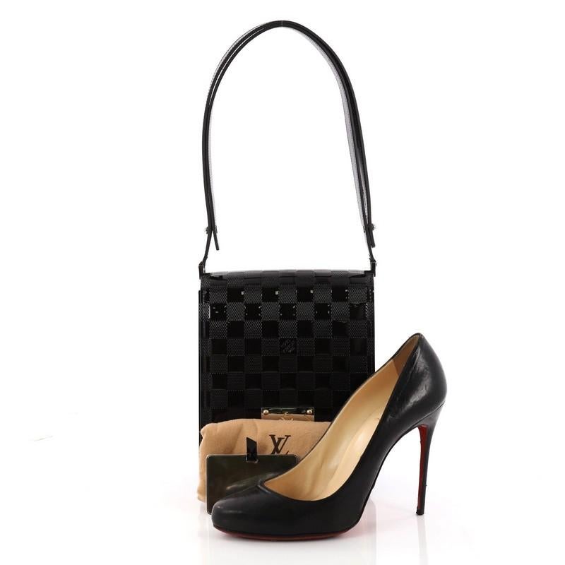 This authentic one-of-a-kind Louis Vuitton Limited Edition Cabaret Club Damier Vernis in black is great for light travel. Coated with striking patent Damier Vernis leather, this petite bag features the brand's geometric Damier pattern design, unique