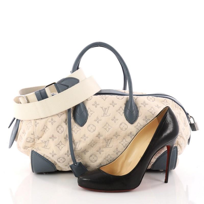 This authentic Louis Vuitton Round Speedy Bag Monogram Denim mixes casual, airy style with a fresh look great for everyday wear. Crafted from beige monogram denim with silver monogram thread detailing, this round speedy features dual-rolled blue