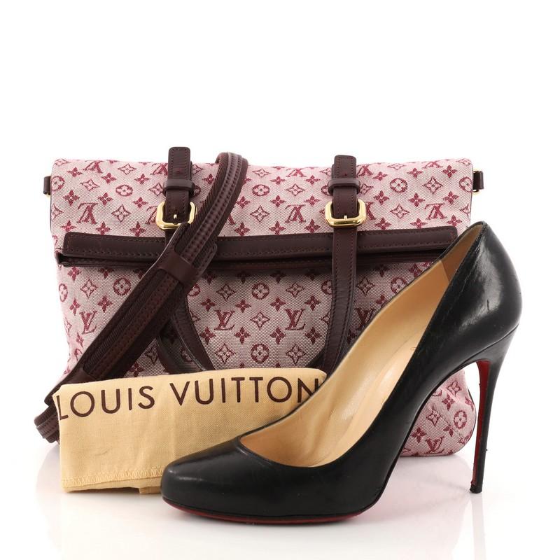 This authentic Louis Vuitton Francoise Handbag Mini Lin is a sporty and sophisticated blend in style. Crafted from the brand's burgundy monogram mini lin fabric, this lightweight fold-over tote features dual-flat leather top handles, burgundy