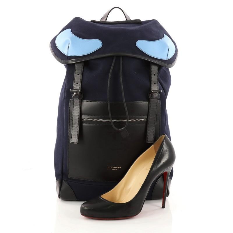 This authentic Givenchy Rider Backpack Canvas with Leather is perfect for on-the-go fashionistas. Crafted in blue canvas with black leather, this backpack features front zip pocket, blue leather details, adjustable backpack straps, frontal flap and